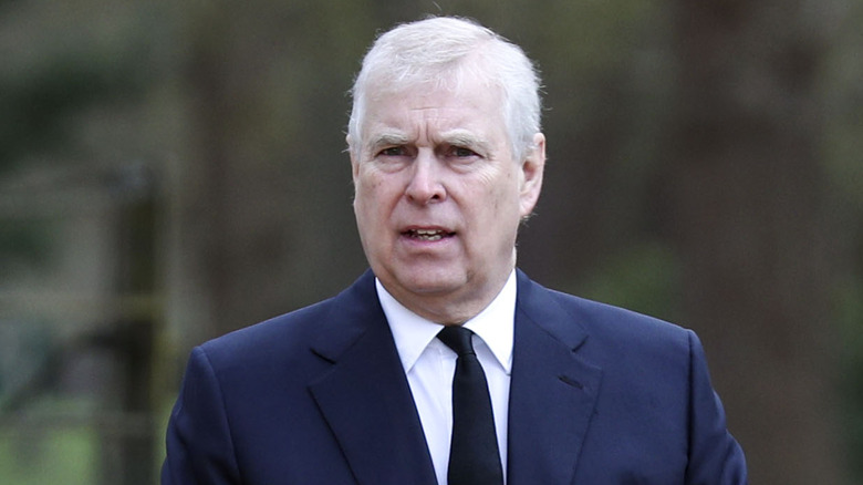 Prince Andrew walking outdoors