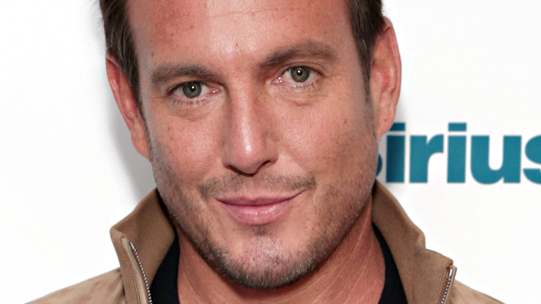 Will Arnett with slight smile