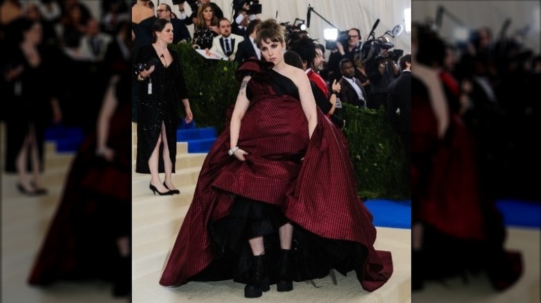 Lena Dunham wearing gingham dress and boots