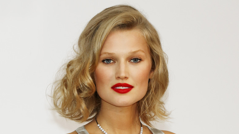 Toni Garrn poses in red lipstick