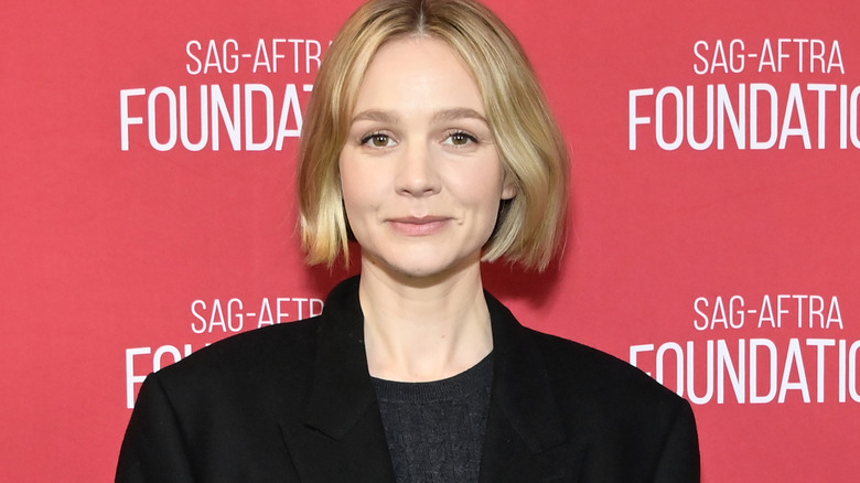 Carey Mulligan posing at event