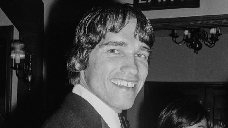 Young Arnold Schwarzenegger smiling