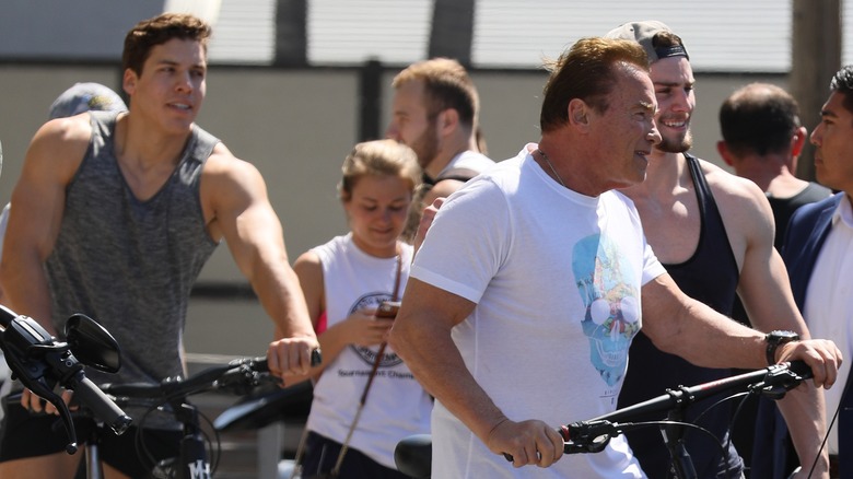 Arnold Schwarzenegger and his son Joseph Baena riding bikes
