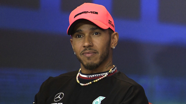 Lewis Hamilton wears a baseball hat