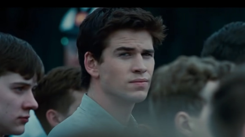 Liam Hemsworth looking away in crowd