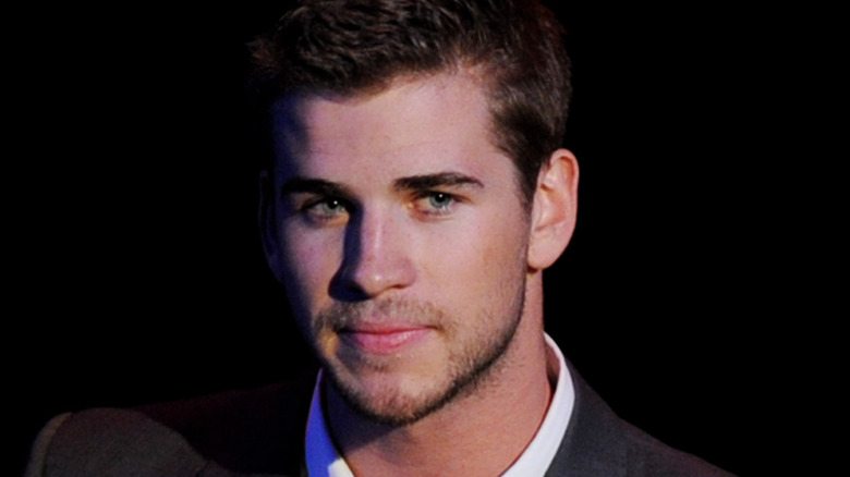 Liam Hemsworth looking away