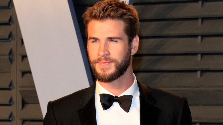 Liam Hemsworth looking away