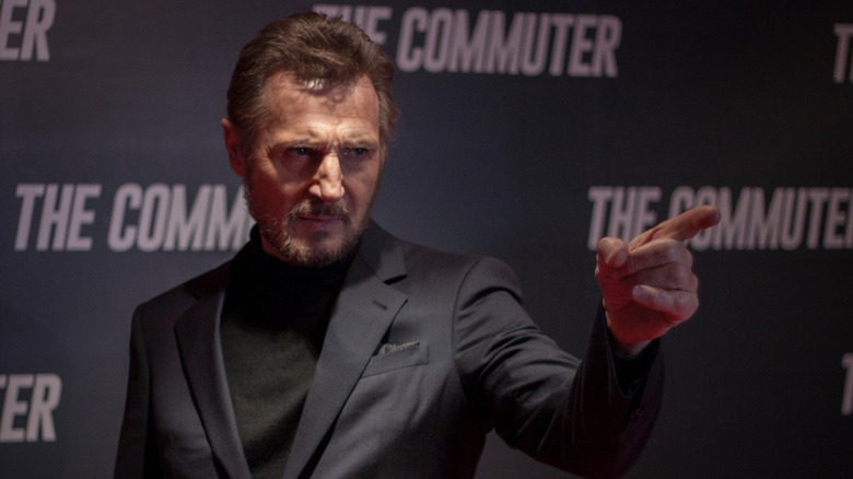 Liam Neeson poses 