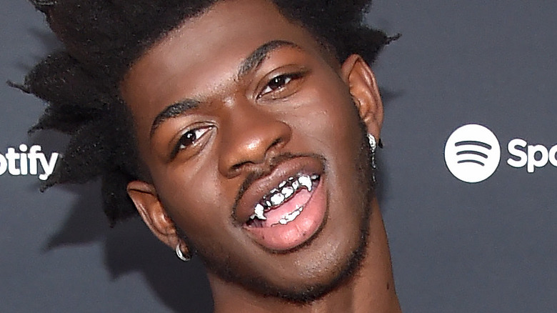 Lil Nas X makign playful expression on red carpet