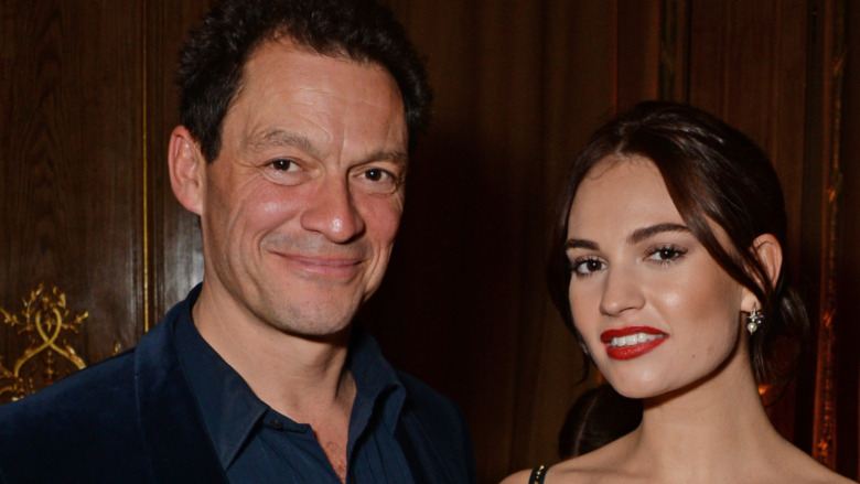 Dominic West and Lily James smiling