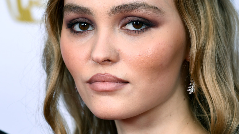 Lily-Rose Depp not smiling smokey eye