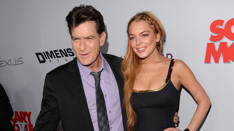 Charlie Sheen with arm around Lindsay Lohan