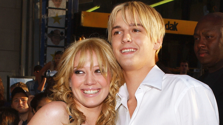 Hilary Duff smiling with Aaron Carter