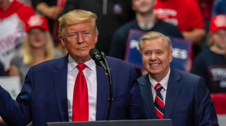 Donald Trump and Lindsey Graham on stage