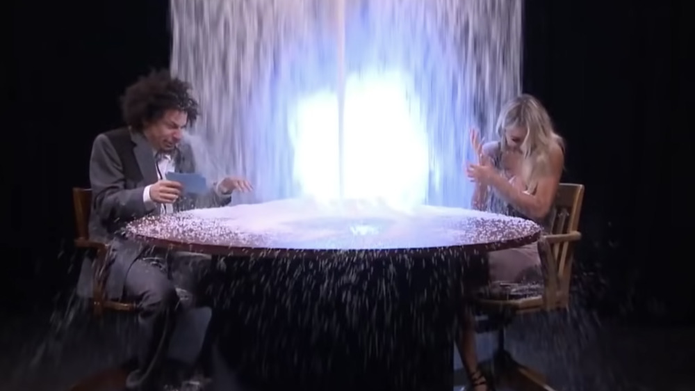 Eric Andre and Lindsey Pelas getting covered in rice