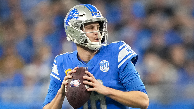 Jared Goff preparing to pass football on field