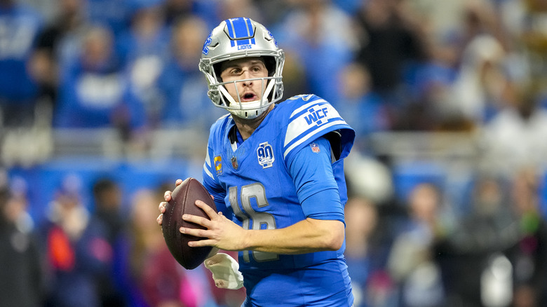 Jared Goff preparing to pass football on field