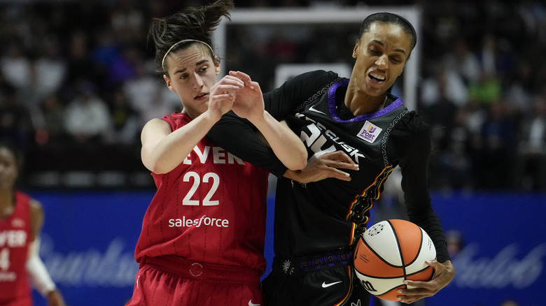 Caitlin Clark and DeWanna Bonner on the court