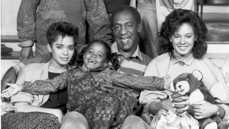 The Cosby family posing on the couch