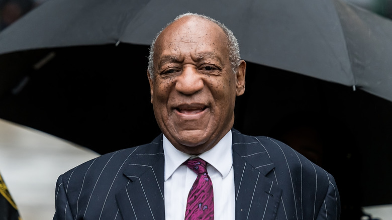 Bill Cosby smiling during his trial