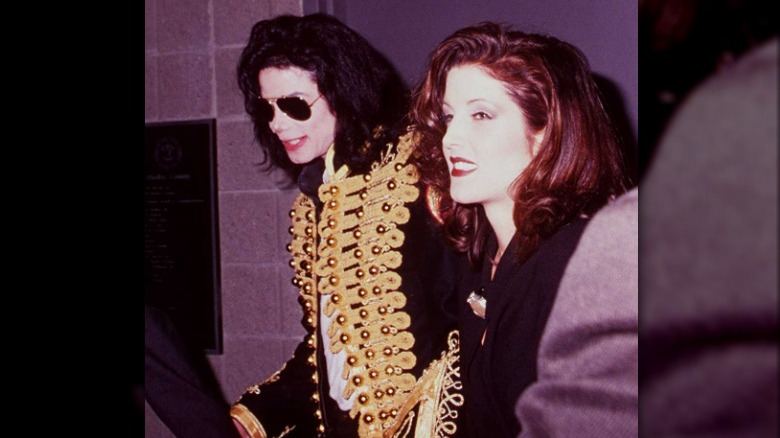 Lisa Marie Presley posing with Michael Jackson