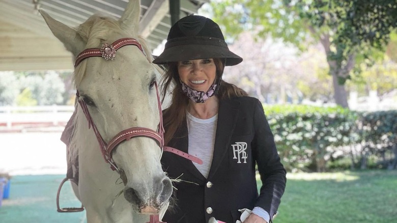 Lisa Vanderpump posing with horse