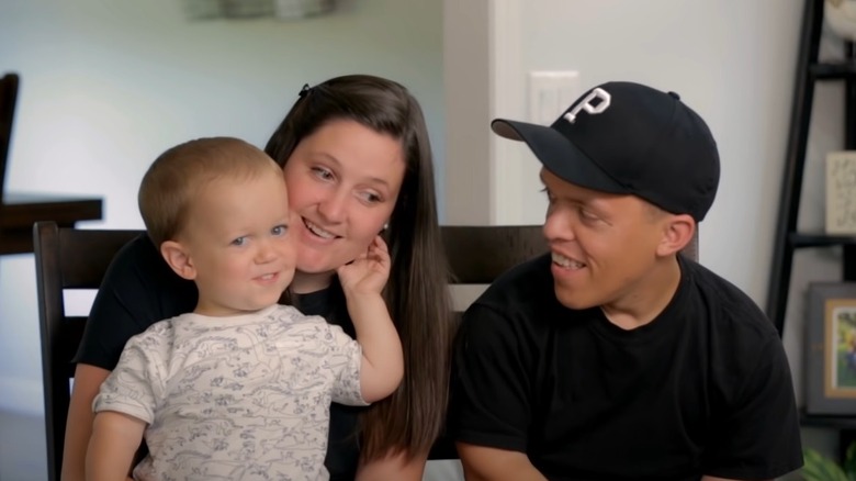 Zach Roloff and Tori Roloff with Jackson on her lap