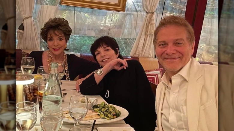 Joan Collins, Liza Minnelli, and Michael Feinstein enjoying dinner together