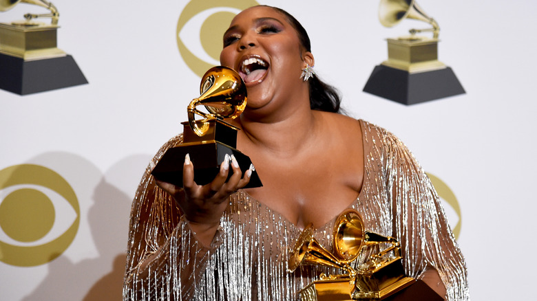 Lizzo laughs with her Grammy awards