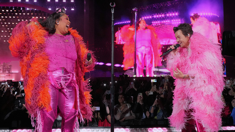 Lizzo and Harry Styles performing in pink