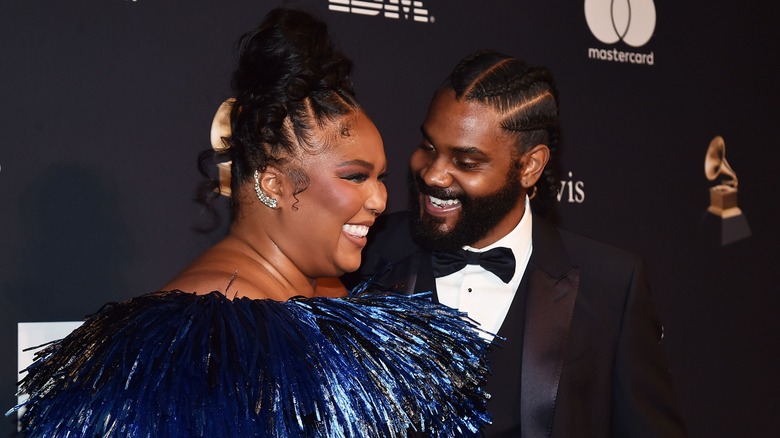 Lizzo and Myke Wright laughing