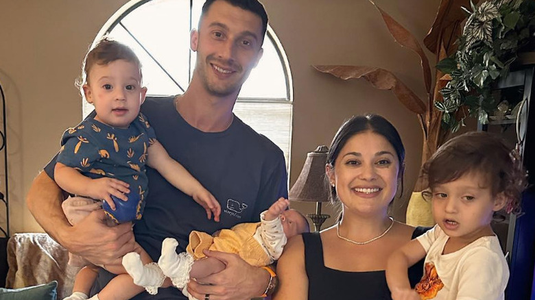 Alexei and Loren Brovarnik are pictured with their kids on Thanksgiving