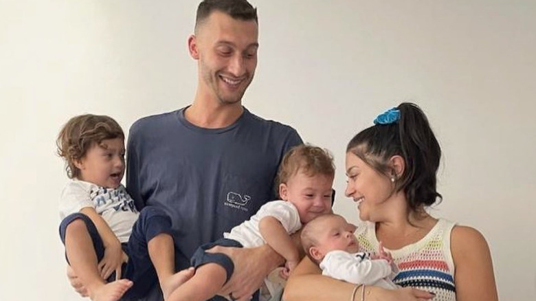 Loren and Alexei Brovarnik pose with their three kids