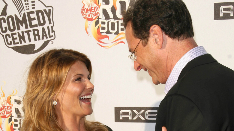 Lori Loughlin and Bob Saget embrace on the red carpet