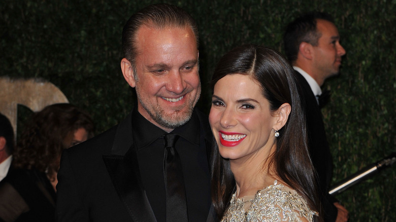 Jesse James and Sandra Bullock smiling