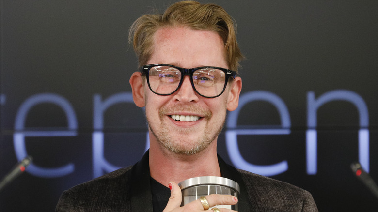 Macaulay Culkin wearing glasses