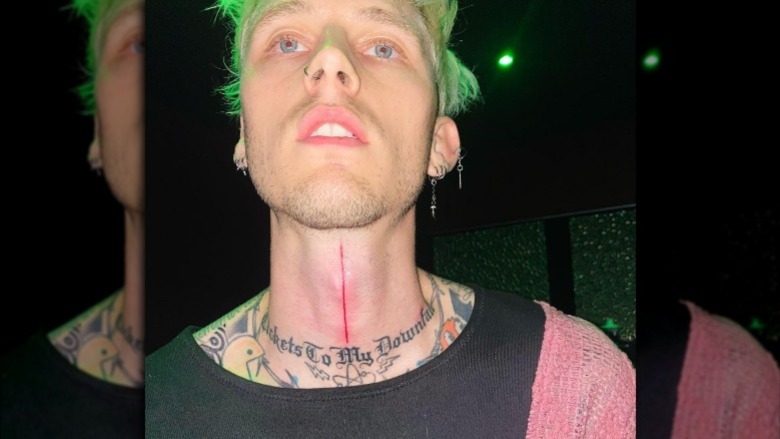 Machine Gun Kelly shows off his new neck tattoo