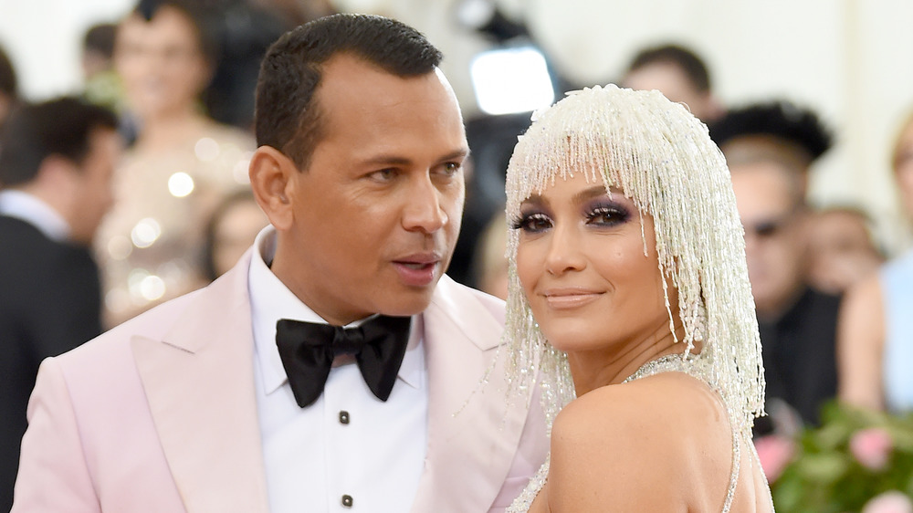 Alex Rodriguez and Jennifer Lopez posing at the Met Gala