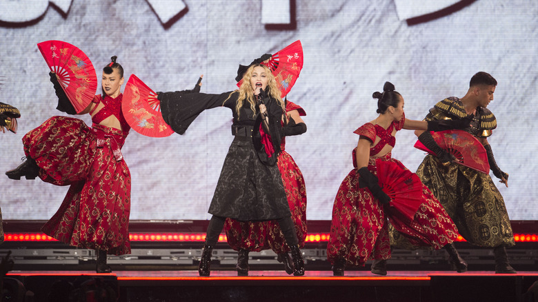 Madonna on stage with dancers