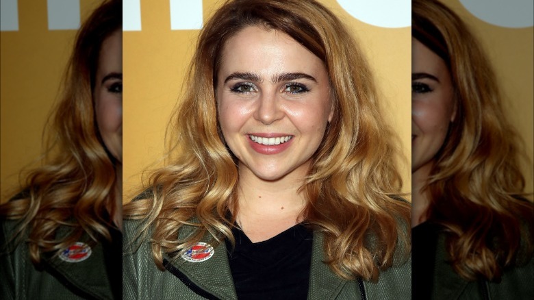 Mae Whitman posing on red carpet 