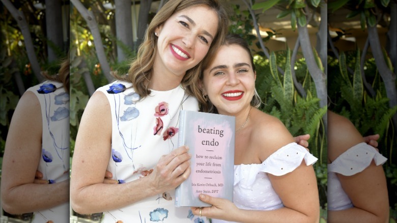 Mae Whitman posing with "Beating Endo" book