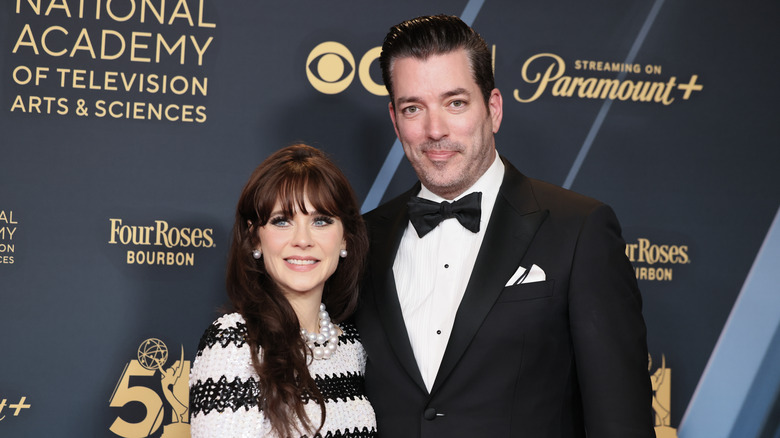 Zooey Deschanel, Jonathan Scott wearing black-and-white clothing