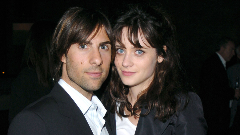 Jason Schwartzman, Zooey Deschanel with faces close together