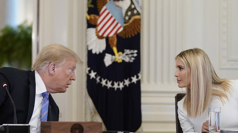 Donald Trump and Ivanka Trump speaking during a meeting of the American Workforce Policy Advisory