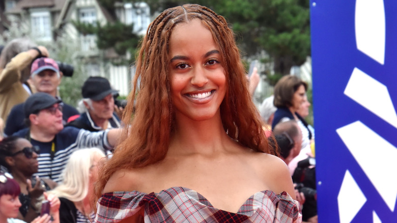 Malia Obama wearing a plaid side-shouldered gown