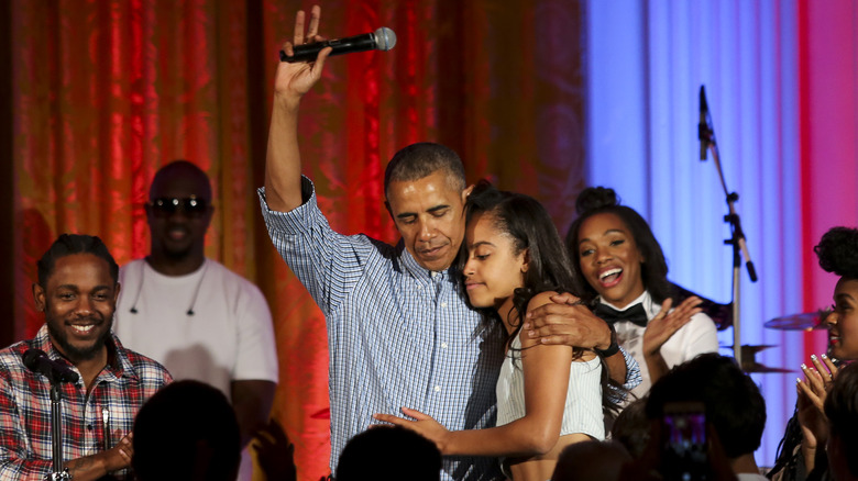 Barack Obama hugging Malia Obama