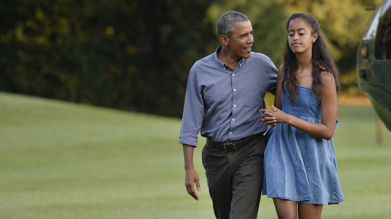 Barack and Malia Obama arriving at the White House