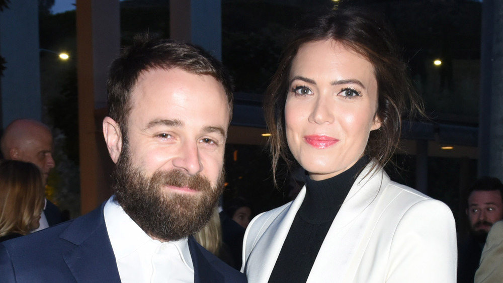 Taylor Goldsmith and Mandy Moore posing together at an event