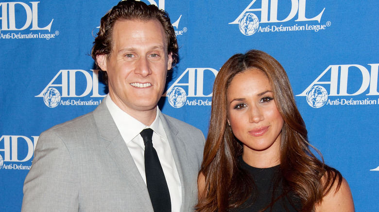 Meghan Markle and Trevor Engelson posing