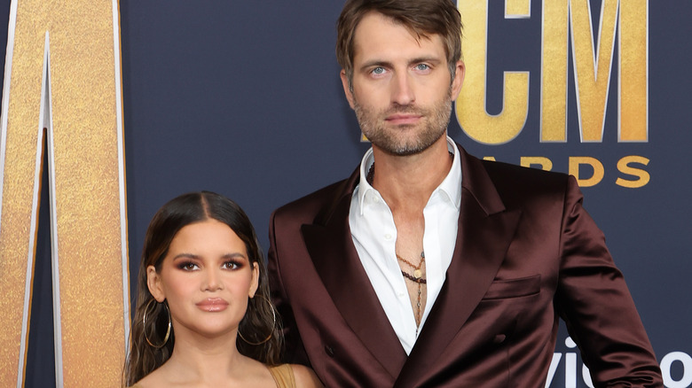 Maren Morris and husband Ryan Hurd posing in 2022